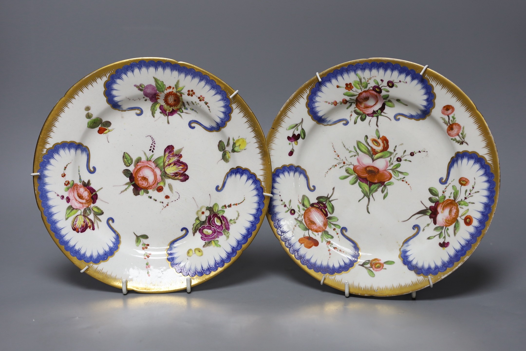 An stone china plate and a pair of Coalport floral plates, c.1815, Ironstone plate 22cms diameter